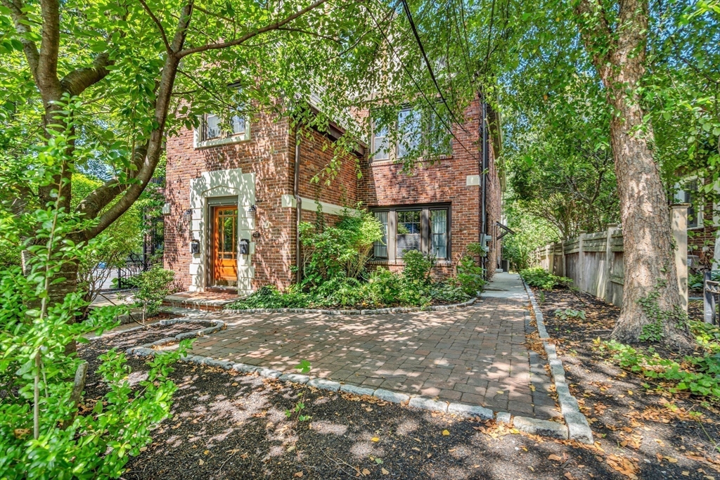 27 Newell Road, Unit 2 Brookline, MA 02446 - Photo 39 of 41 a brick building with a tree in front of it