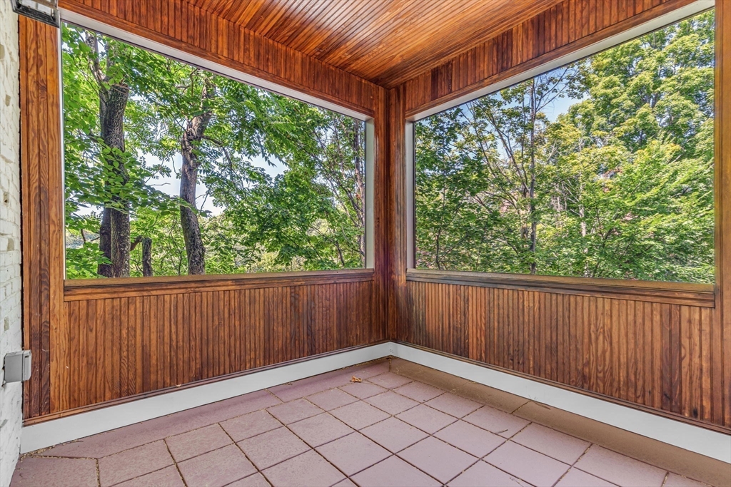 27 Newell Road, Unit 2 Brookline, MA 02446 - Photo 6 of 41 an empty room with wooden floor and windows