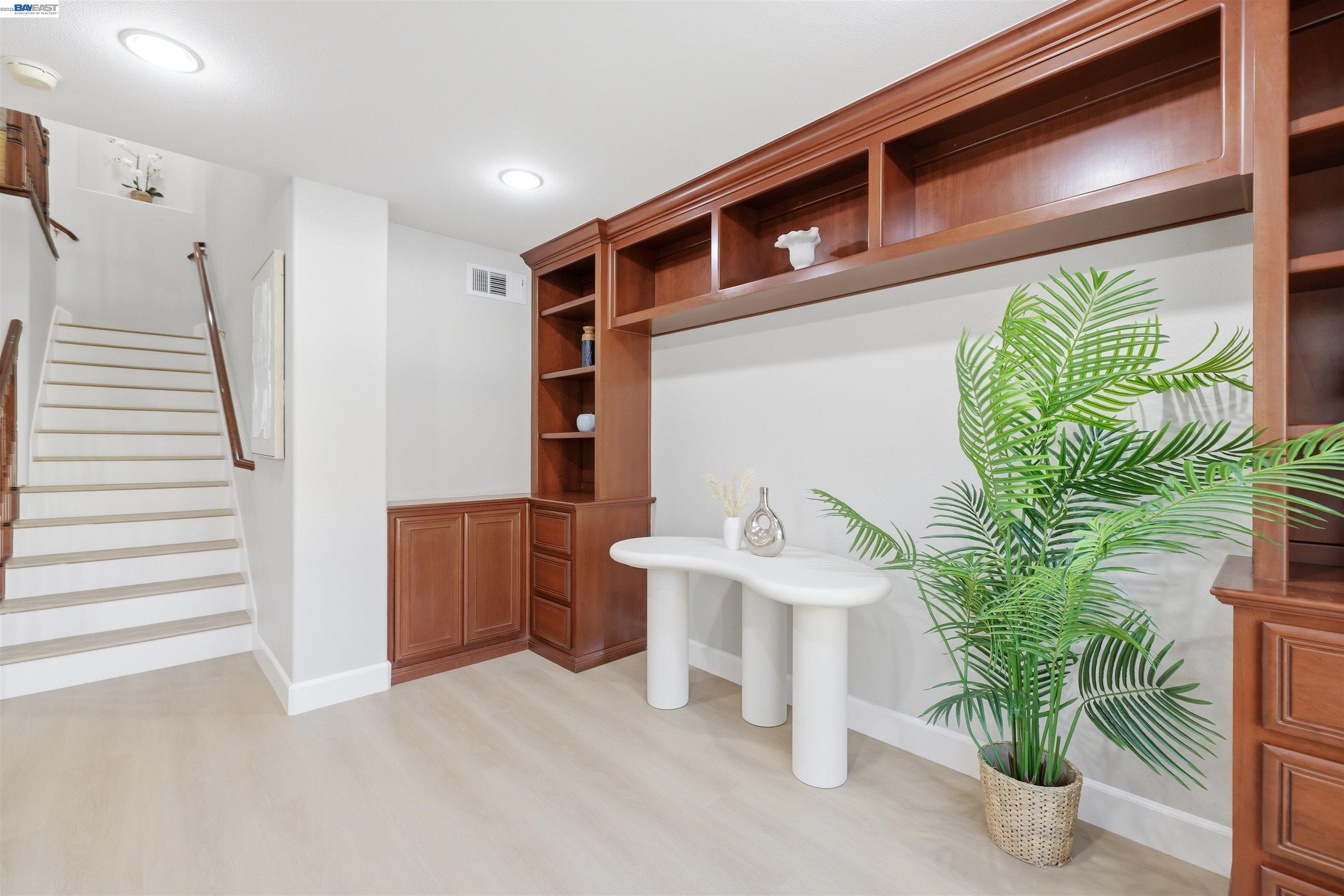 116 Macedon Court San Ramon, CA 94582 - Photo 23 of 60 a living room with couches painting and a potted plant