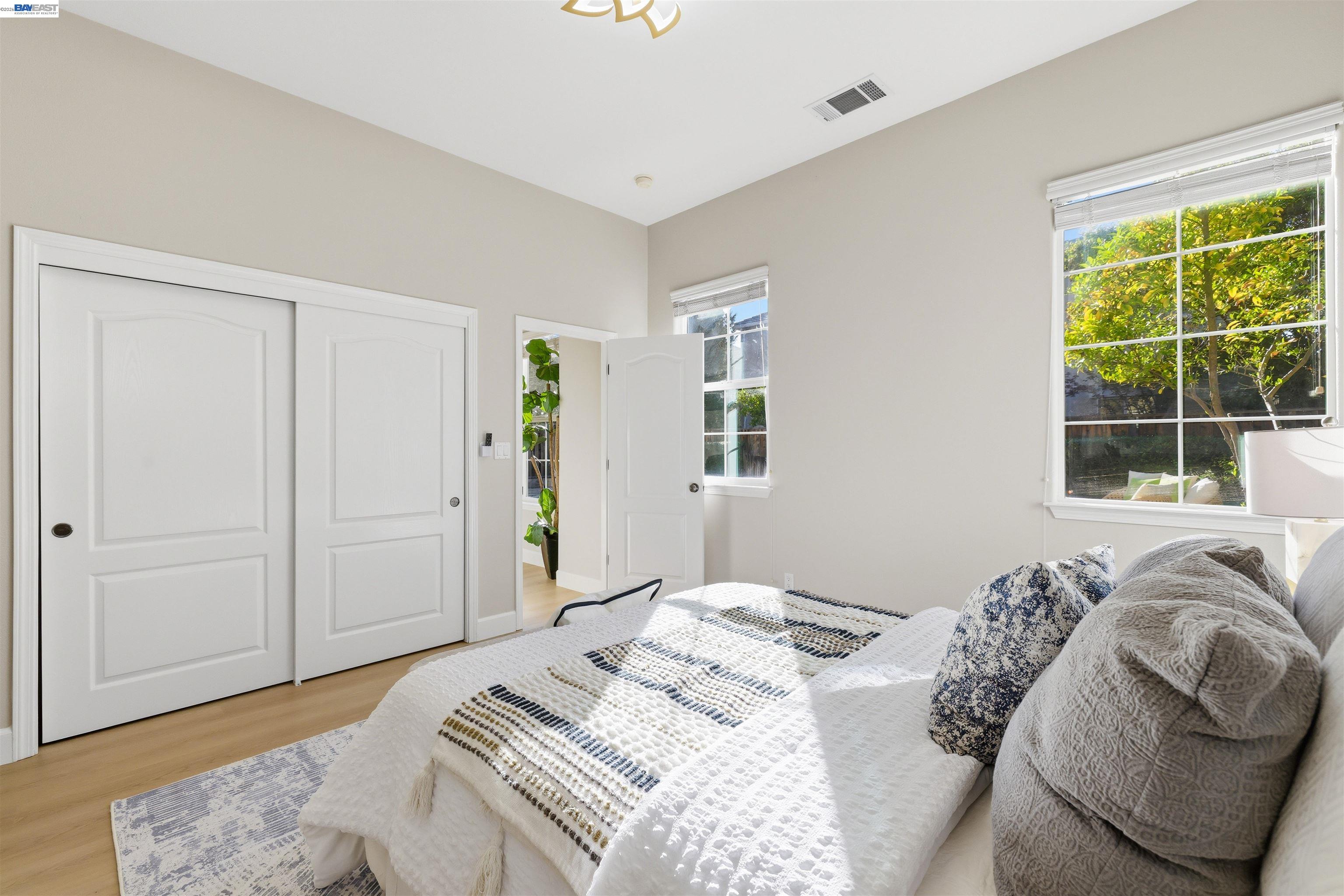 116 Macedon Court San Ramon, CA 94582 - Photo 27 of 60 a bedroom with a bed and a window with outer view
