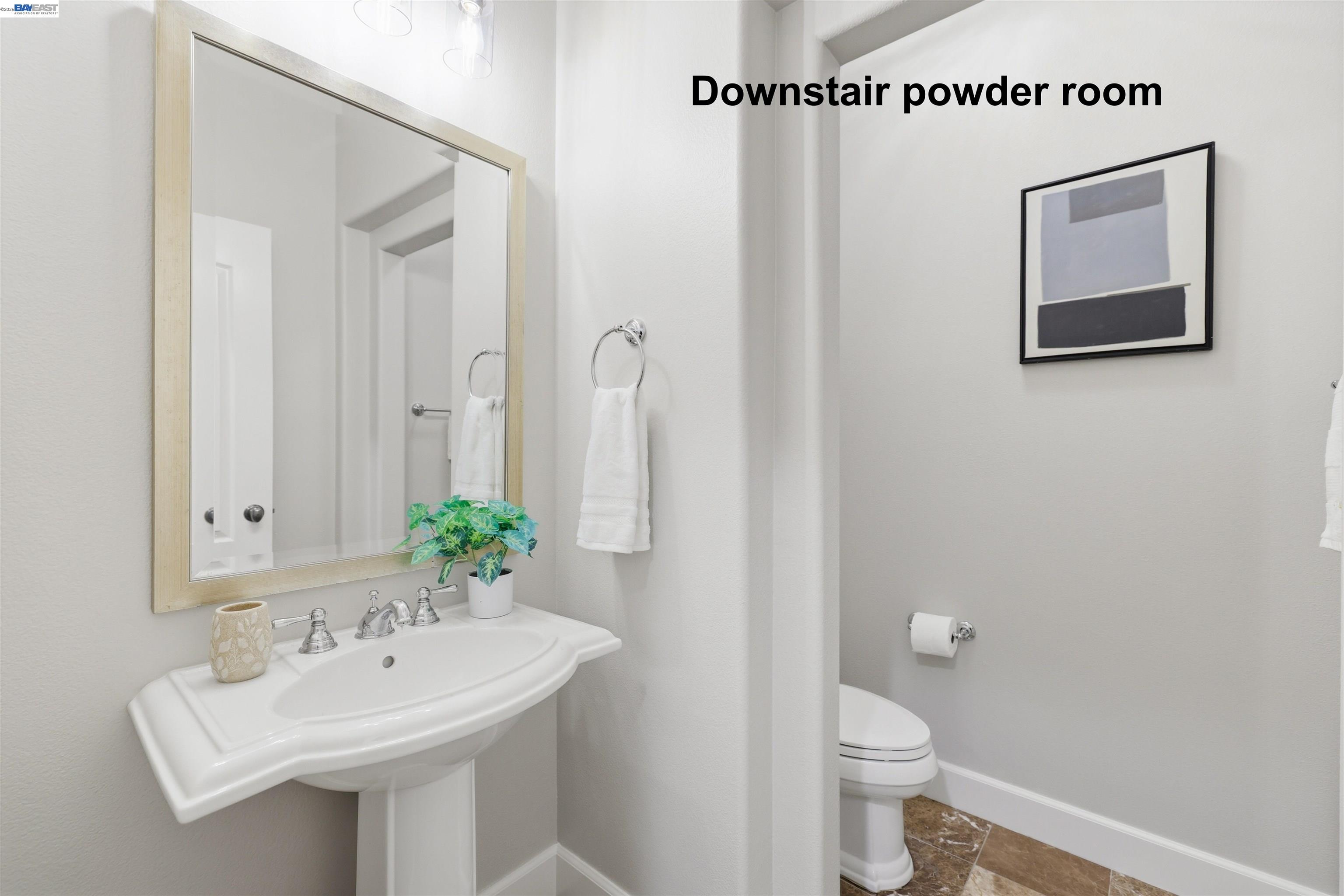 116 Macedon Court San Ramon, CA 94582 - Photo 29 of 60 a bathroom with a sink mirror and a toilet