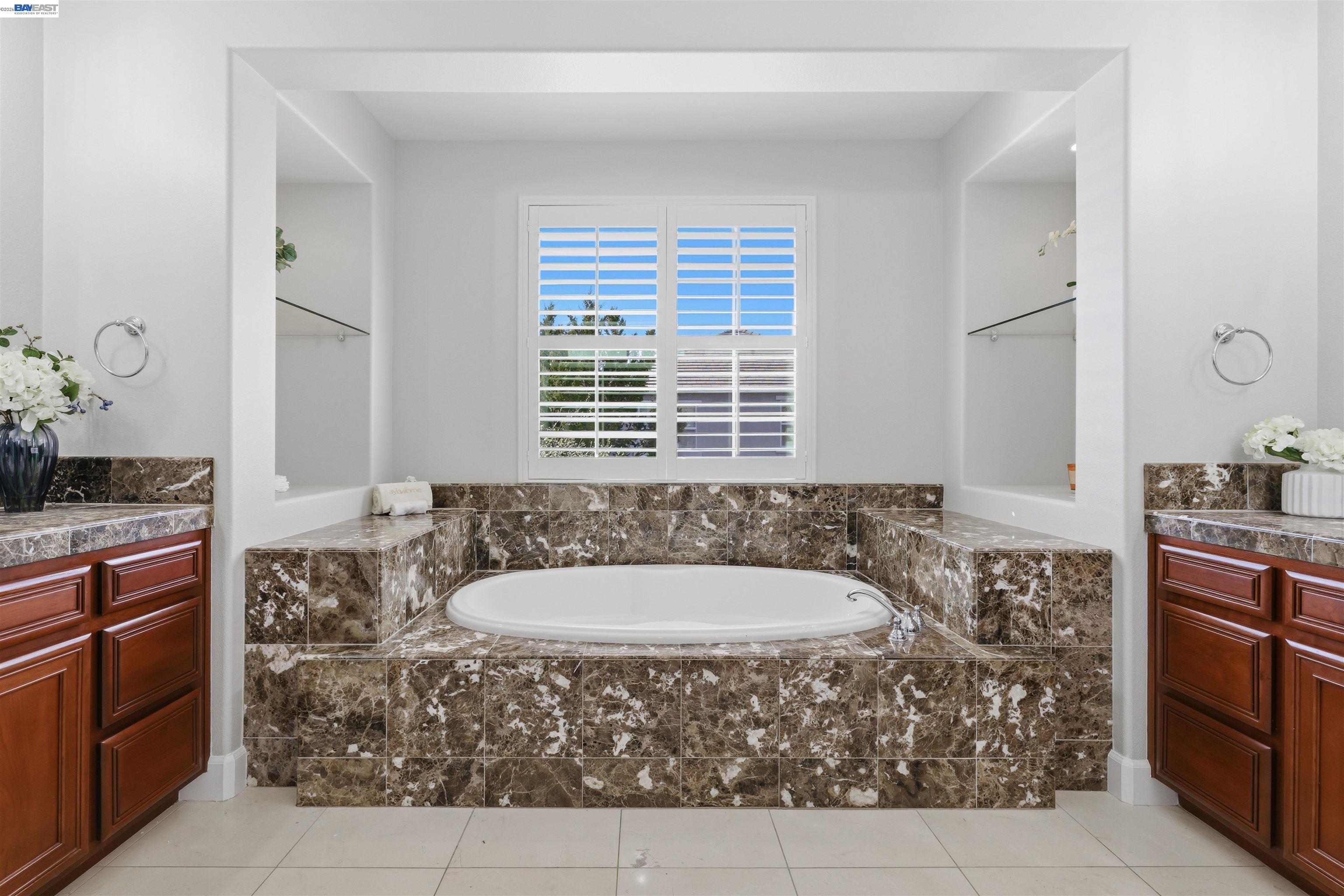 116 Macedon Court San Ramon, CA 94582 - Photo 41 of 60 a bath tub sitting in a bathroom next to a sink