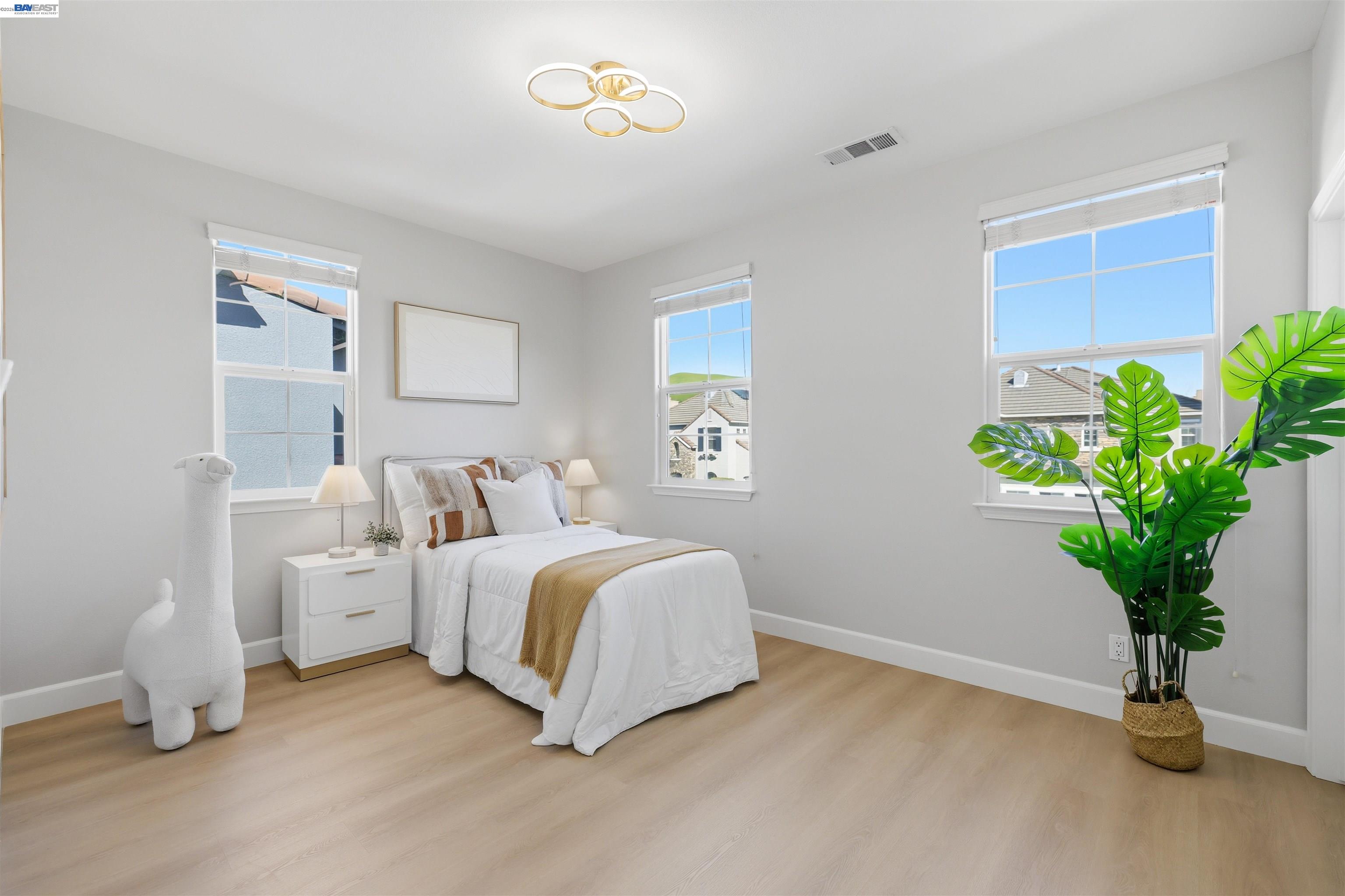 116 Macedon Court San Ramon, CA 94582 - Photo 44 of 60 a spacious bedroom with a bed and a potted plant