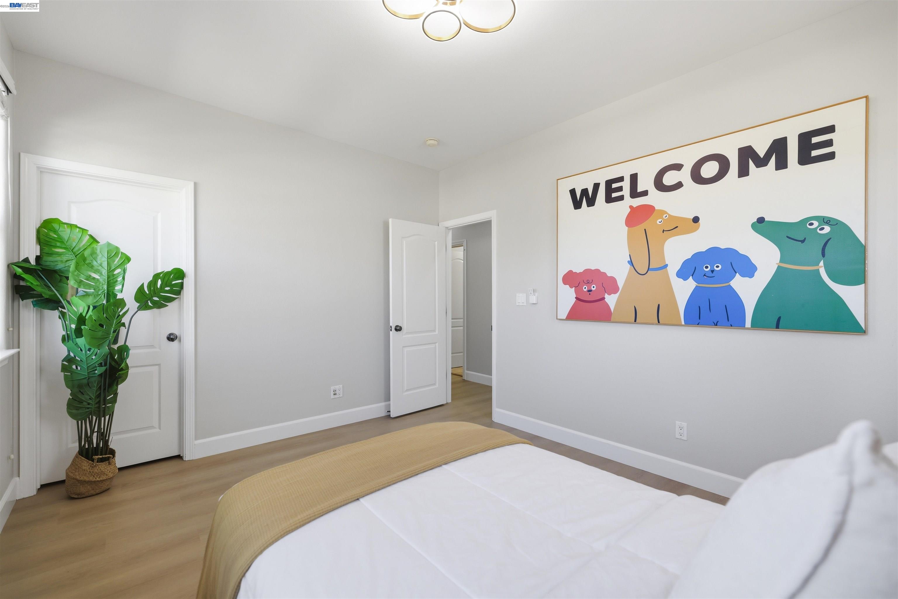 116 Macedon Court San Ramon, CA 94582 - Photo 45 of 60 a bedroom with a bed and a painting on the wall