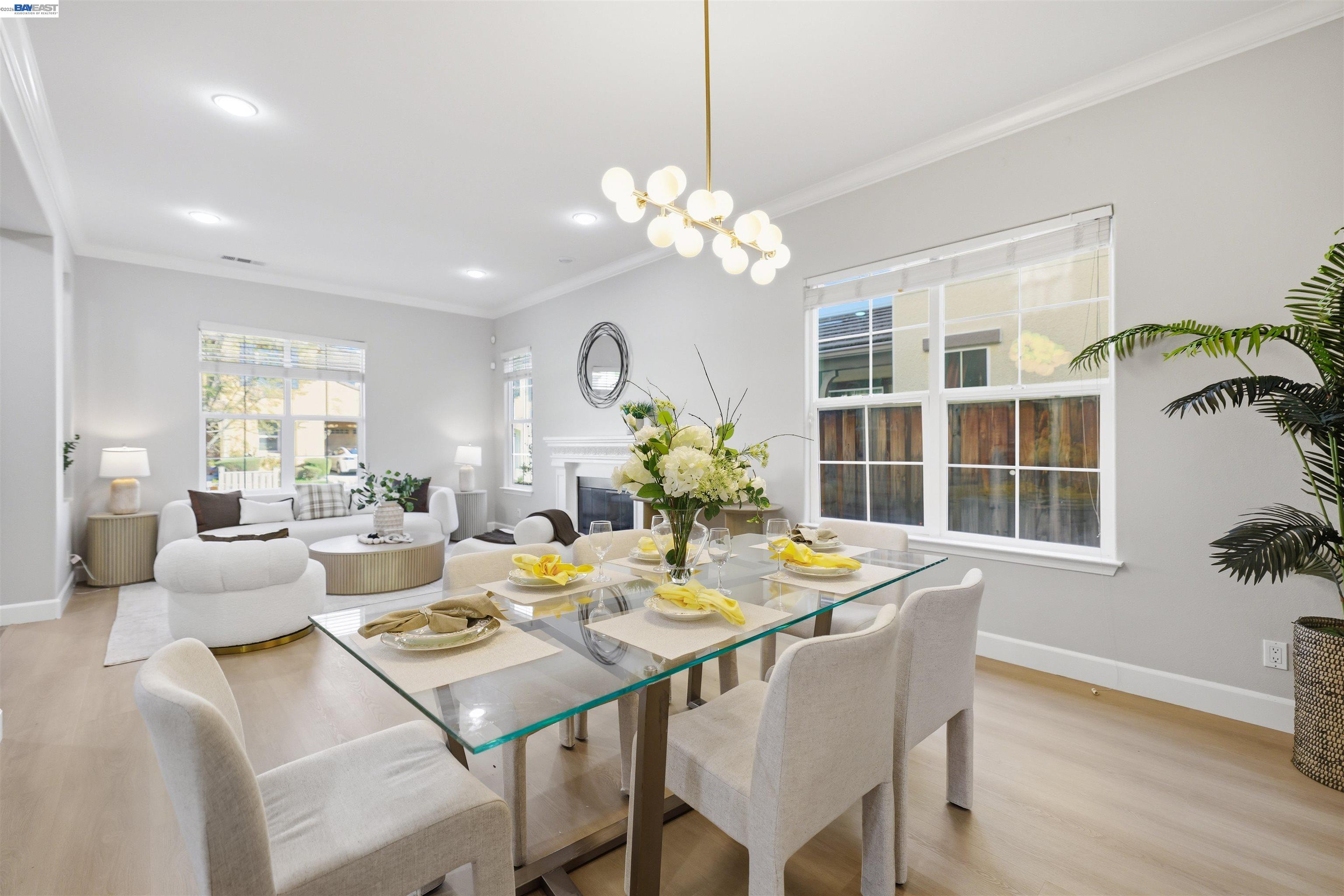 116 Macedon Court San Ramon, CA 94582 - Photo 6 of 60 a view of a dining room and livingroom with furniture wooden floor and a chandelier