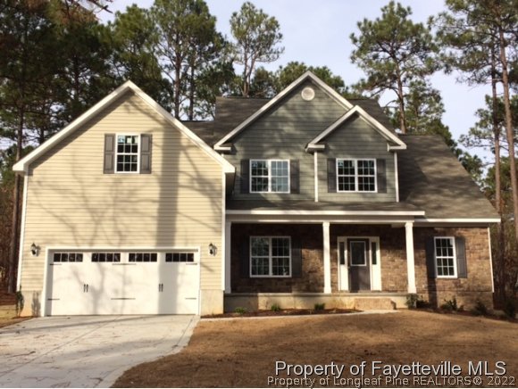 606 Longleaf Road Aberdeen, NC 28315 - Photo 1 of 13 a front view of a house with a yard