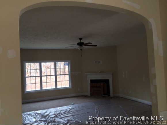 606 Longleaf Road Aberdeen, NC 28315 - Photo 3 of 13 a view of a livingroom with a fireplace