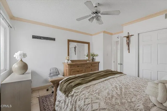 a bedroom with a bed and a table