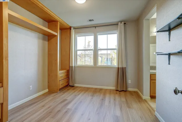 wooden floor and closet in a room