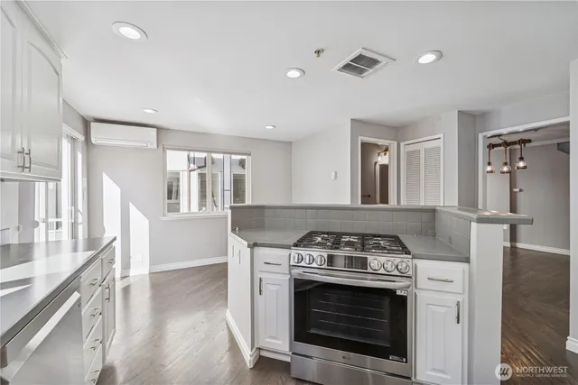 a kitchen with a stove and a sink