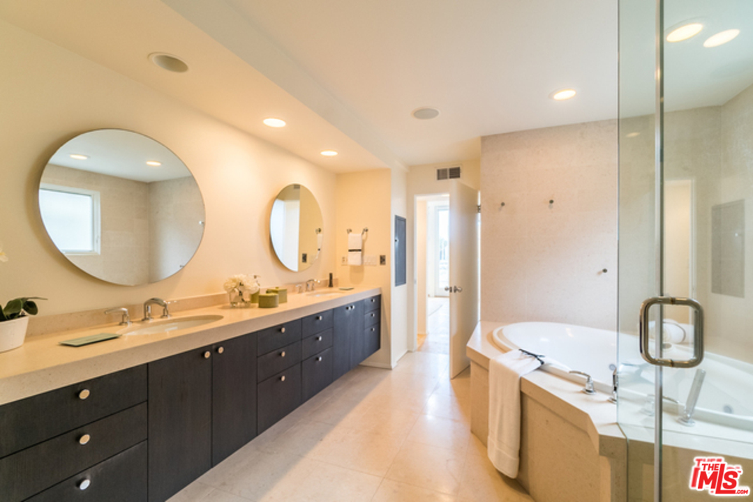 4515 Roma Court Marina del Rey, CA 90292 - Photo 14 of 31 a spacious bathroom with a double vanity sink double mirror and bathtub