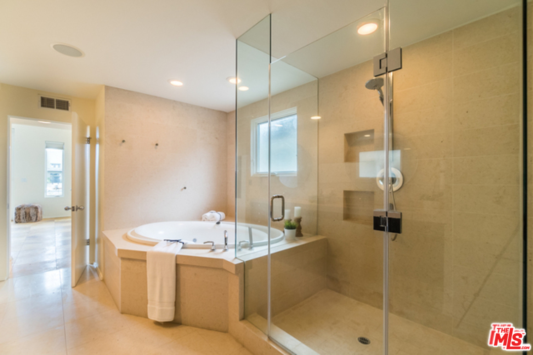 4515 Roma Court Marina del Rey, CA 90292 - Photo 17 of 31 a bathroom with a tub shower sink and mirror