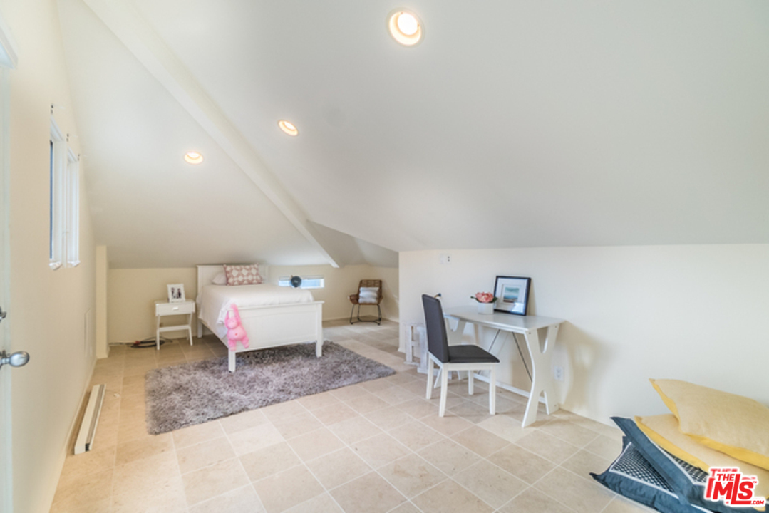 4515 Roma Court Marina del Rey, CA 90292 - Photo 18 of 31 a room with a chair and white walls