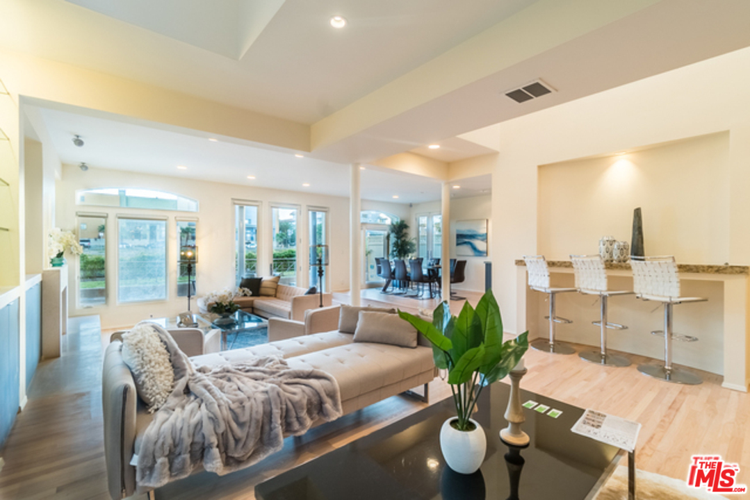 4515 Roma Court Marina del Rey, CA 90292 - Photo 5 of 31 a living room with furniture and a large window