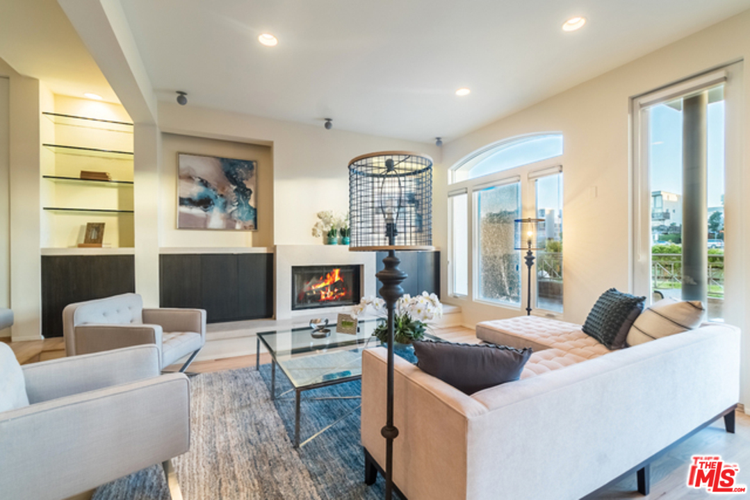 4515 Roma Court Marina del Rey, CA 90292 - Photo 7 of 31 a living room with furniture and a fireplace