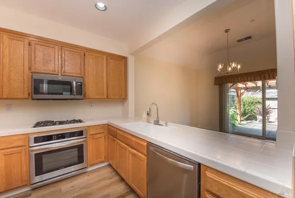 a kitchen with a sink and a microwave