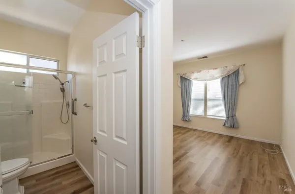 a bathroom with a glass shower door