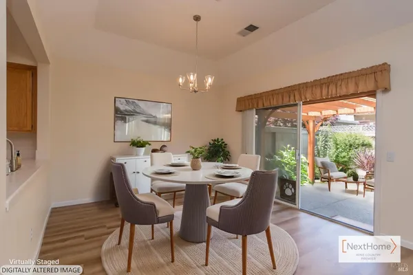 a view of a dining room with furniture window and outside view