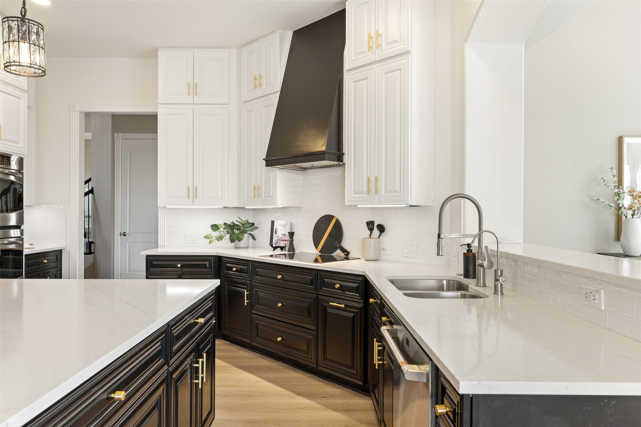 2702 Lakehurst Road Spicewood, TX 78669 - Photo 11 of 40 a kitchen with a sink cabinets and appliances
