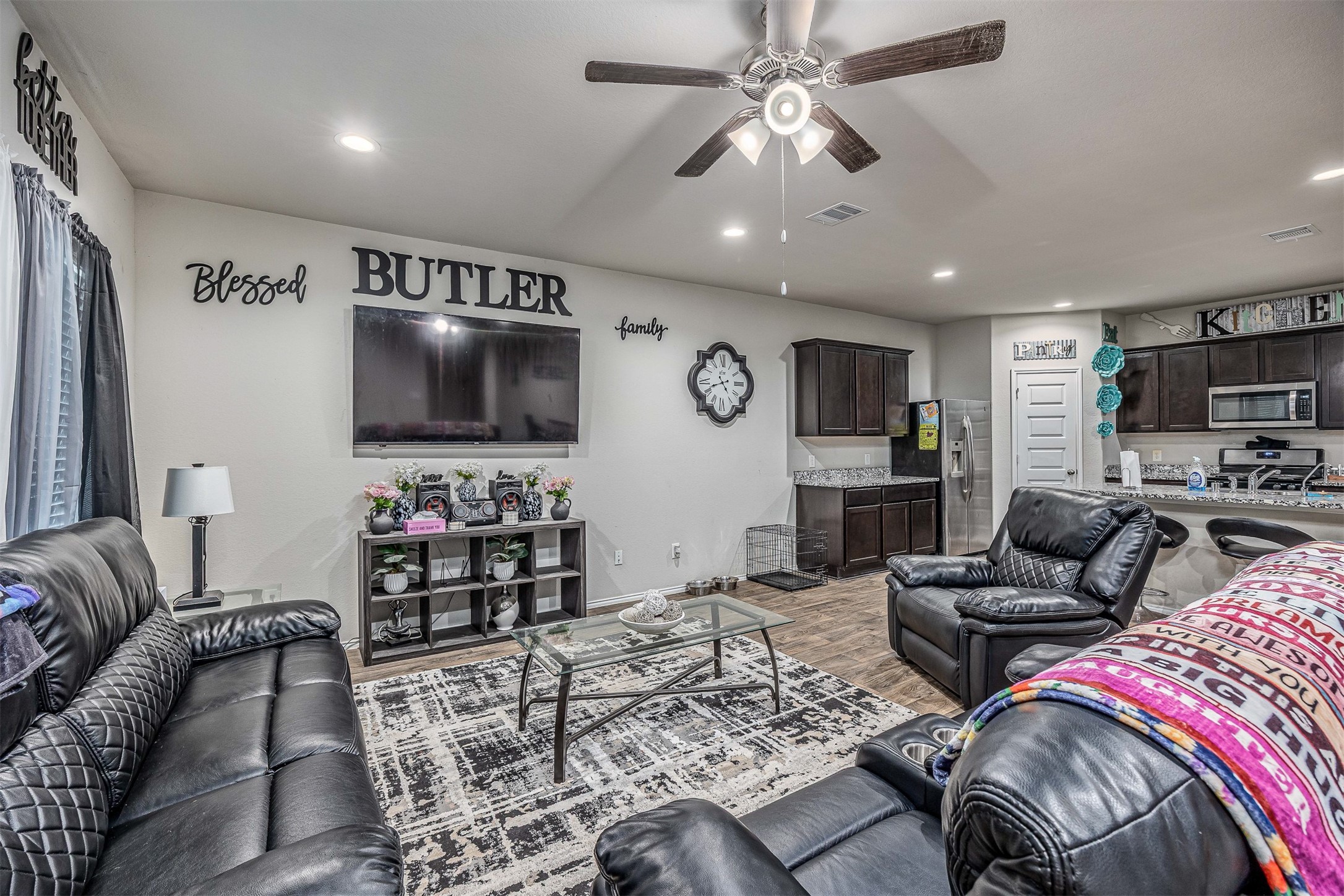 3907 Hawaiian Court Baytown, TX 77521 - Photo 17 of 40 a living room with furniture and a flat screen tv