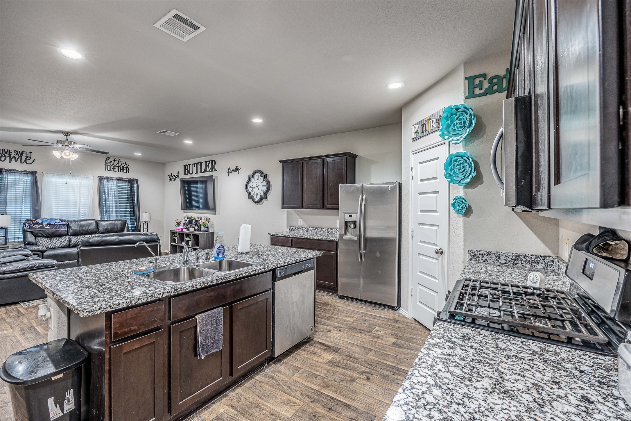3907 Hawaiian Court Baytown, TX 77521 - Photo 22 of 40 a kitchen with sink refrigerator and stove