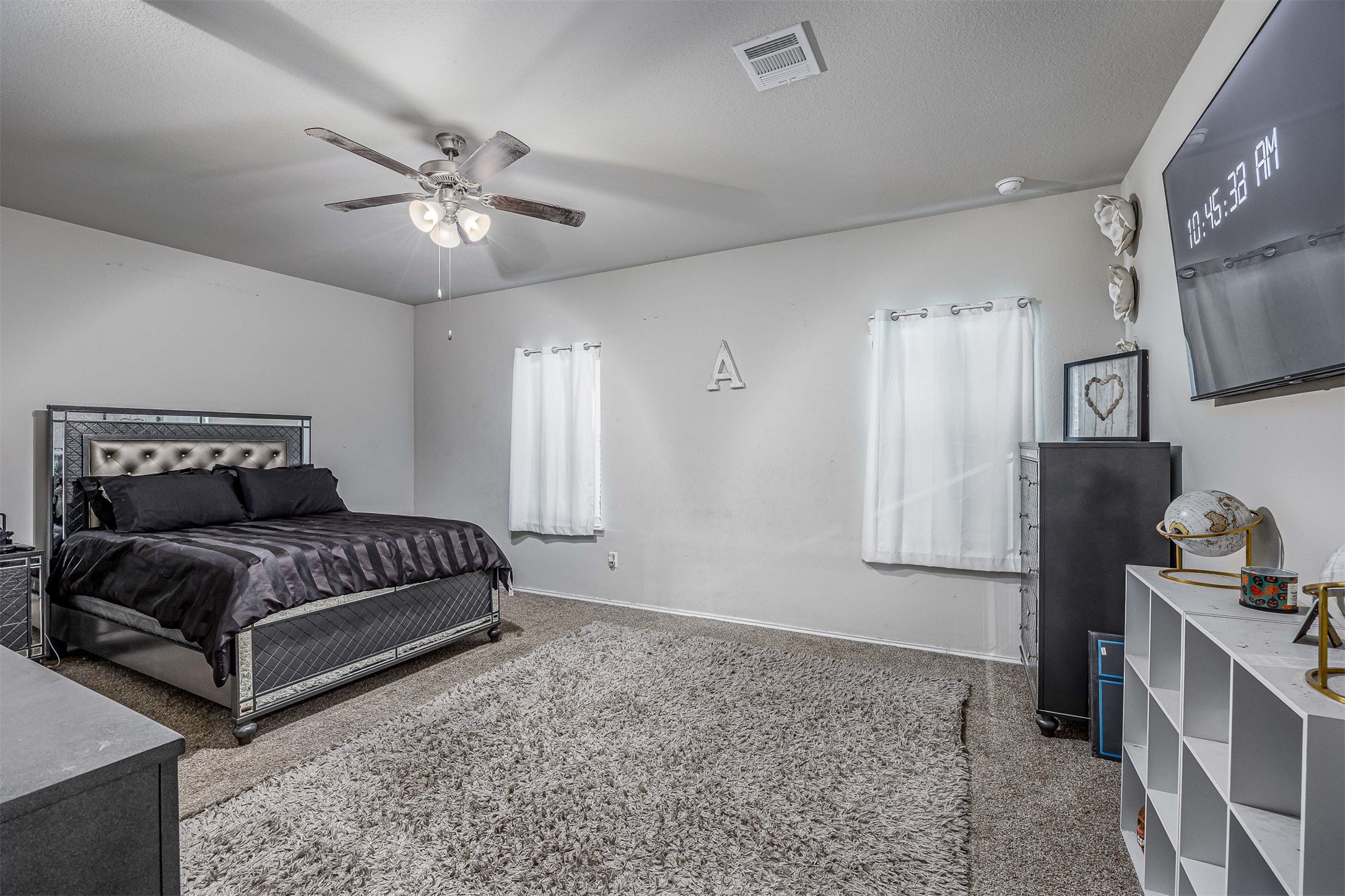 3907 Hawaiian Court Baytown, TX 77521 - Photo 23 of 40 a bedroom with a bed and cabinets