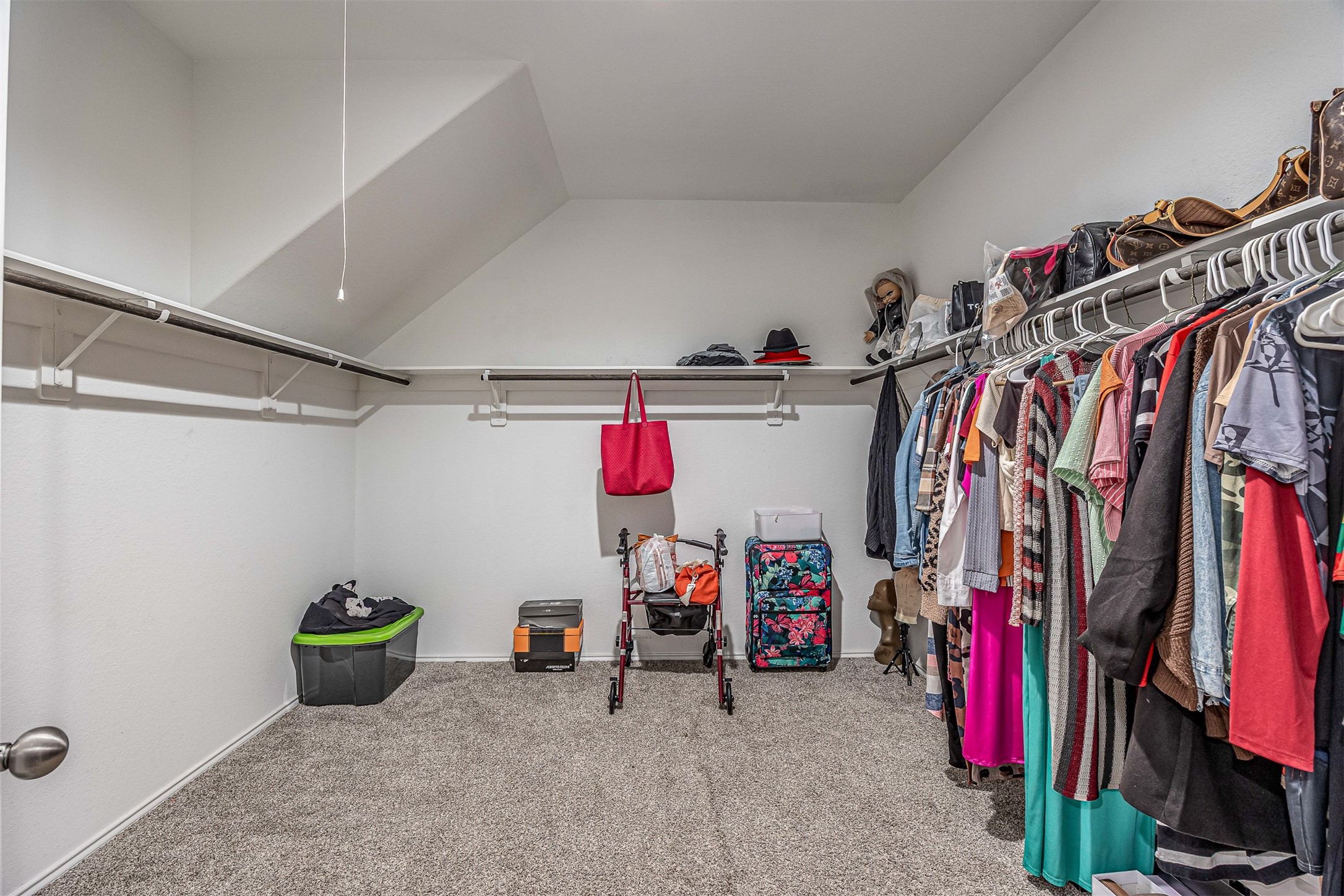 3907 Hawaiian Court Baytown, TX 77521 - Photo 27 of 40 a view of walk in closet with clothes