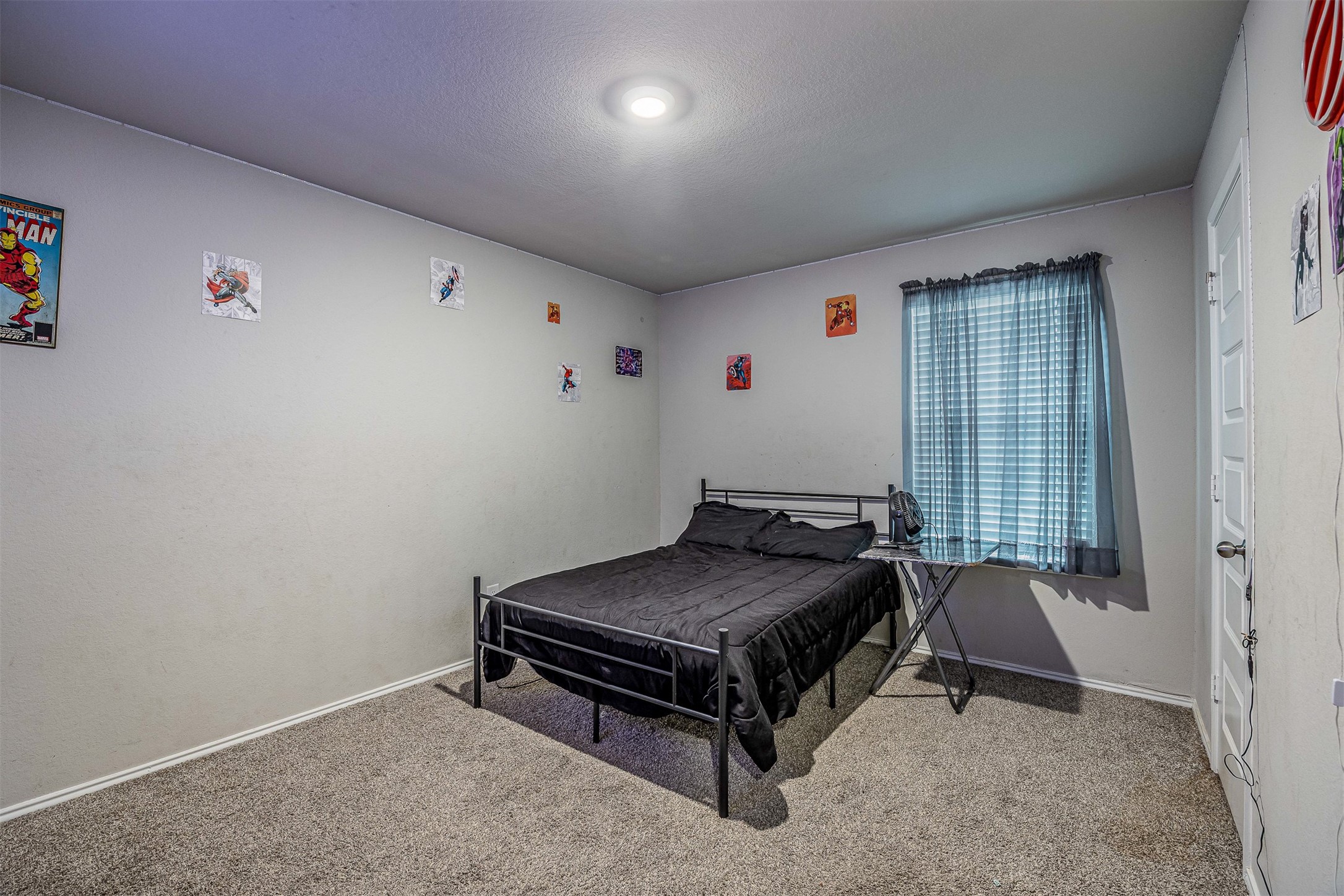 3907 Hawaiian Court Baytown, TX 77521 - Photo 35 of 40 a room with a bed and a table in it