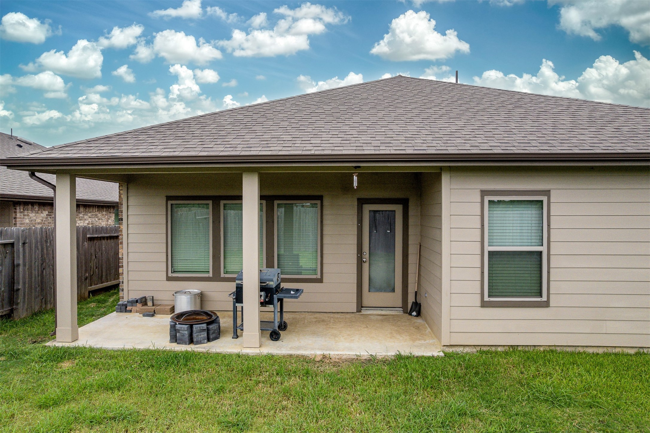 3907 Hawaiian Court Baytown, TX 77521 - Photo 8 of 40 a front view of a house with a yard outdoor seating and garage