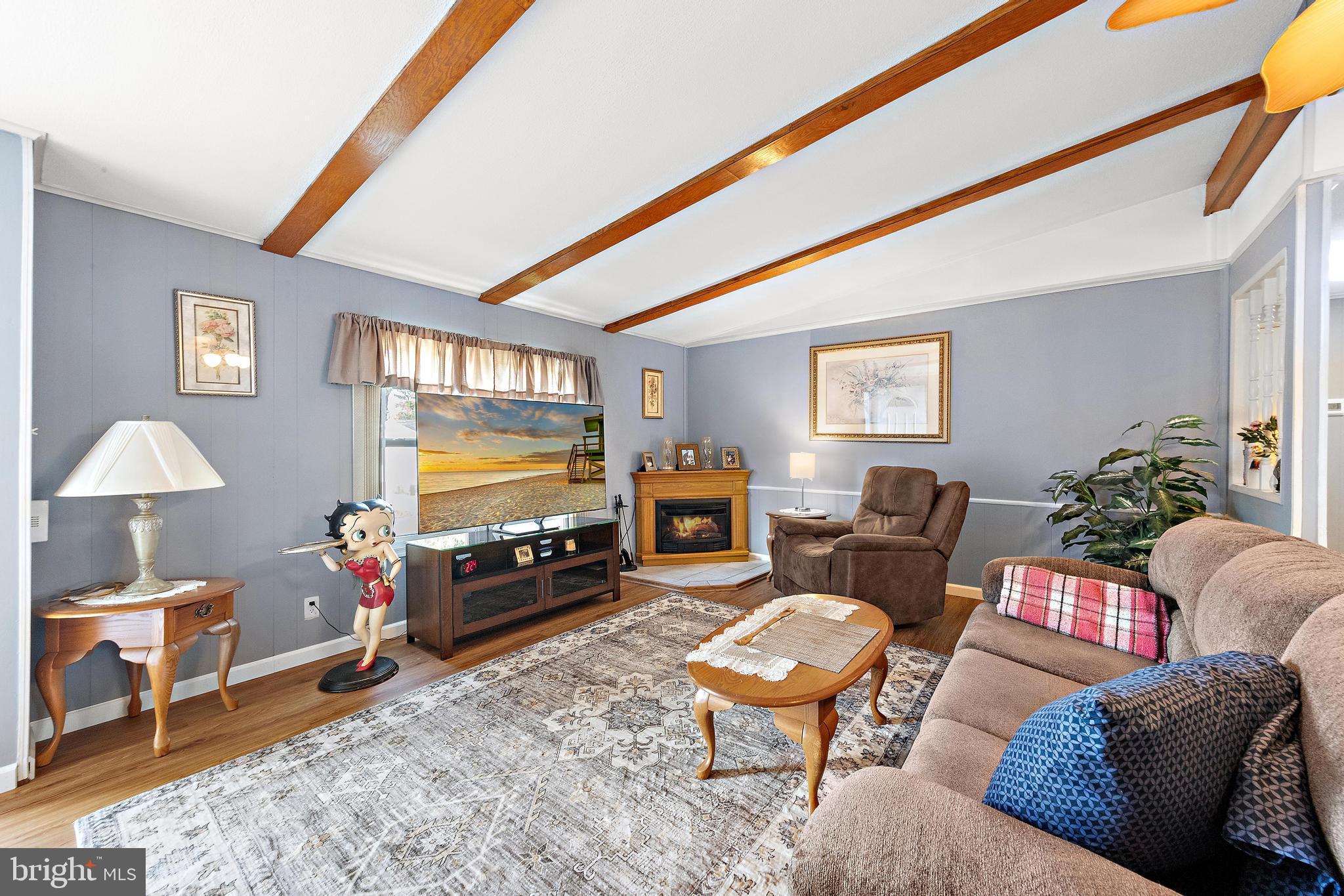 154 Brighton Road Barnegat, NJ 08005 - Photo 11 of 44 a living room with furniture and a flat screen tv