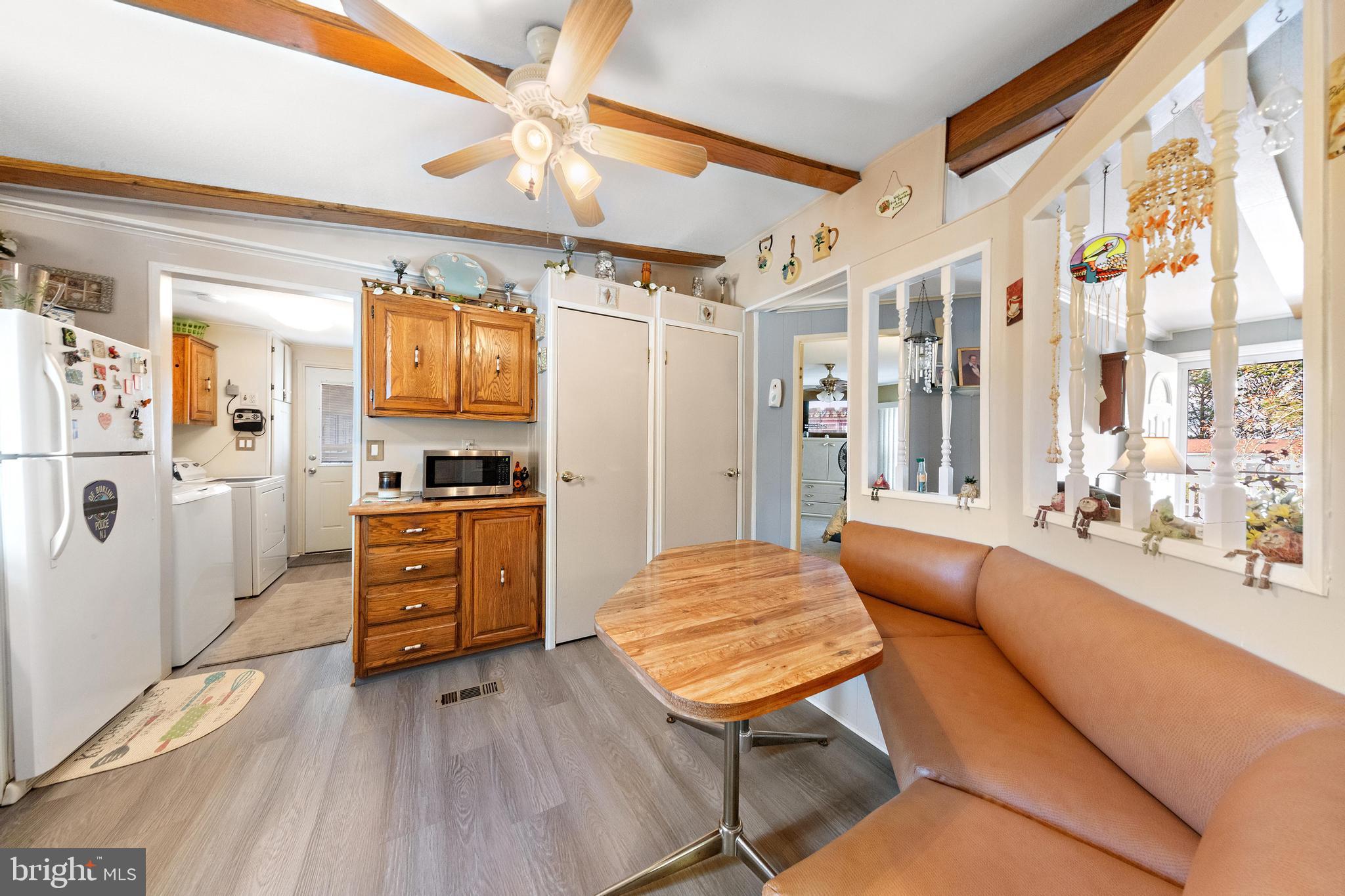154 Brighton Road Barnegat, NJ 08005 - Photo 20 of 44 a kitchen with stainless steel appliances kitchen island granite countertop a refrigerator and microwave