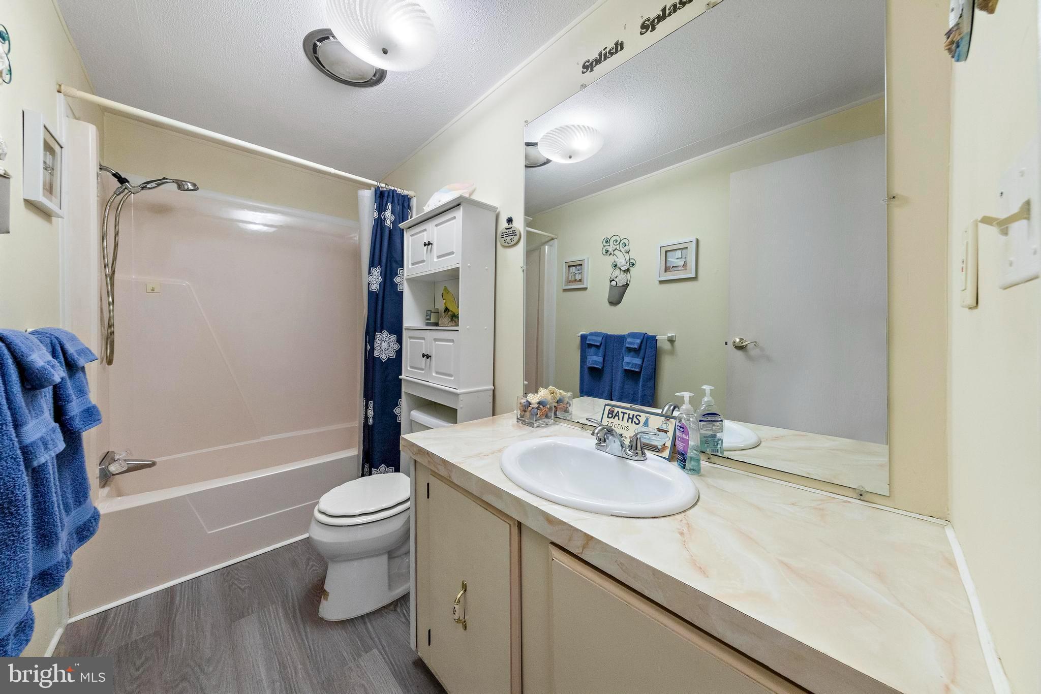 154 Brighton Road Barnegat, NJ 08005 - Photo 34 of 44 a bathroom with a granite countertop sink toilet and shower