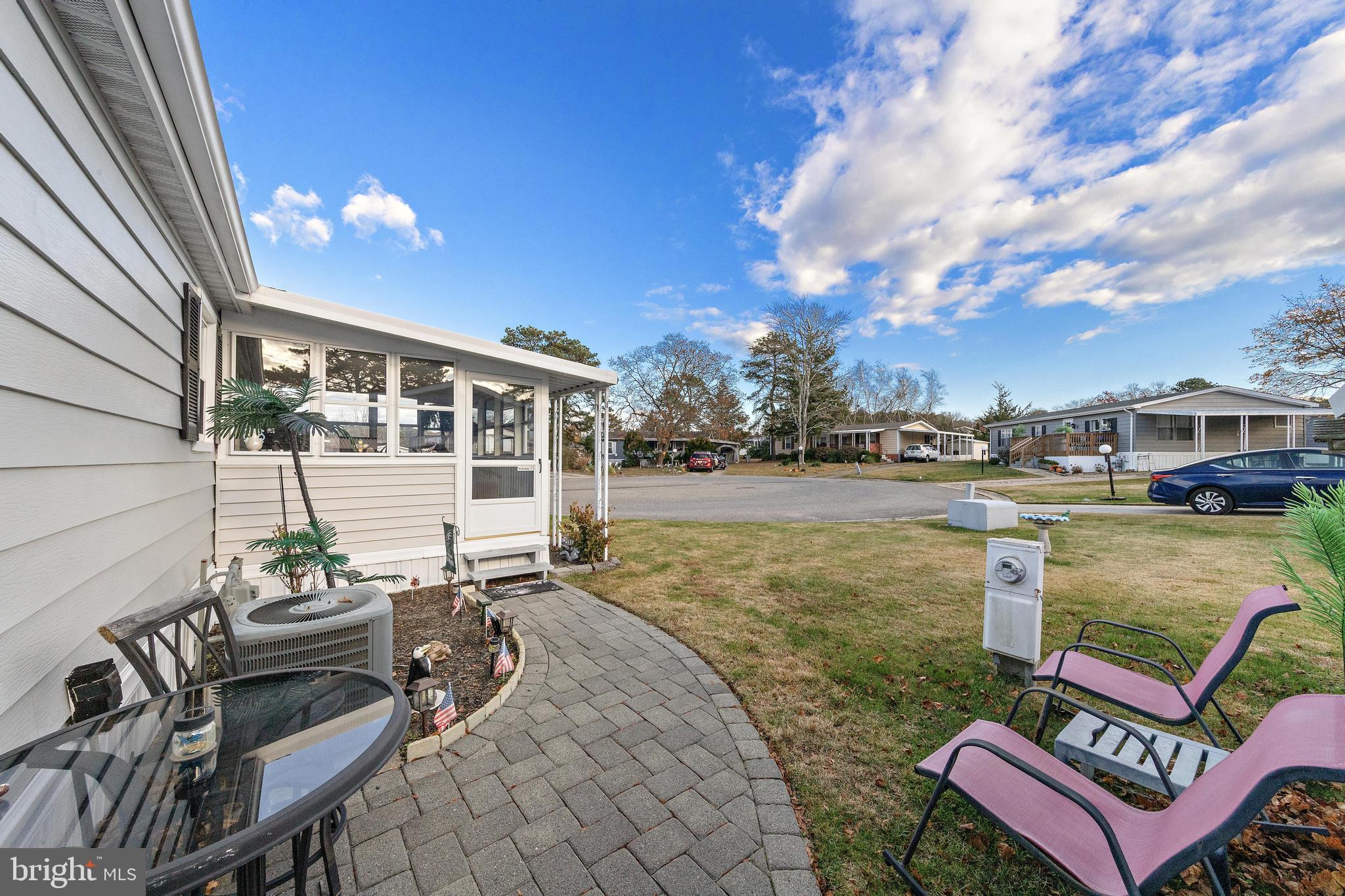 154 Brighton Road Barnegat, NJ 08005 - Photo 40 of 44 a view of a chairs and table in the terrace