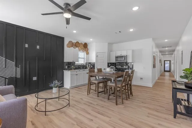 a view of a dining room with furniture window and wooden floor