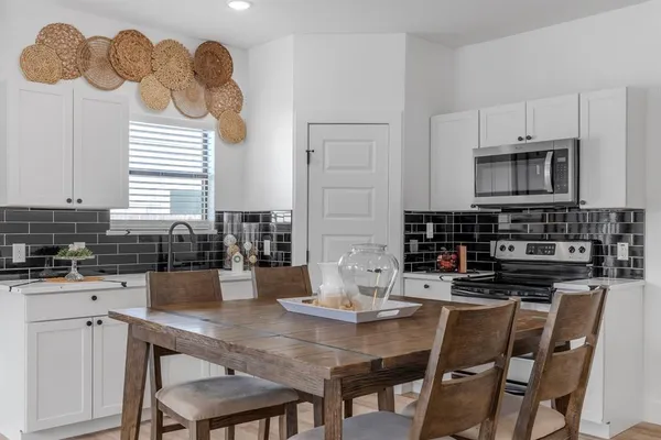 a kitchen with a sink cabinets and window
