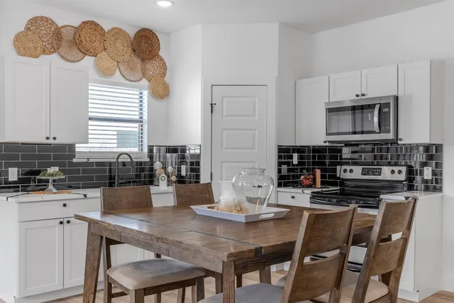 a kitchen with a sink cabinets and window