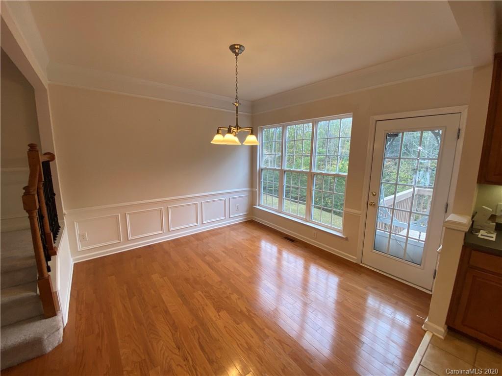 2736 Laurel Cherry Street Raleigh, NC 27612 - Photo 2 of 14 a view of a room with wooden floor and windows