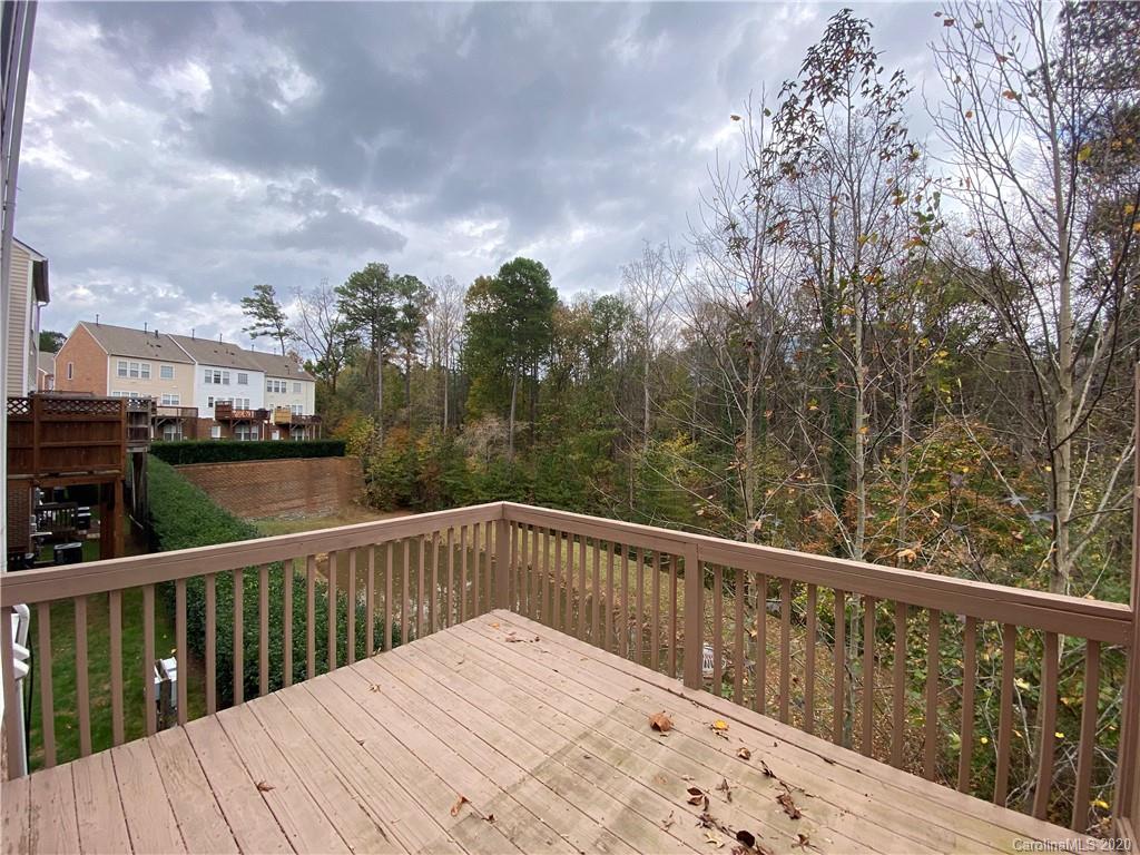 2736 Laurel Cherry Street Raleigh, NC 27612 - Photo 13 of 14 a view of a balcony with wooden fence