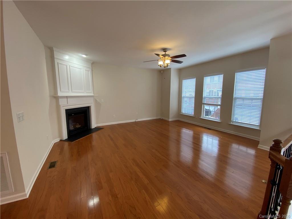 2736 Laurel Cherry Street Raleigh, NC 27612 - Photo 4 of 14 wooden floor in an empty room with a window