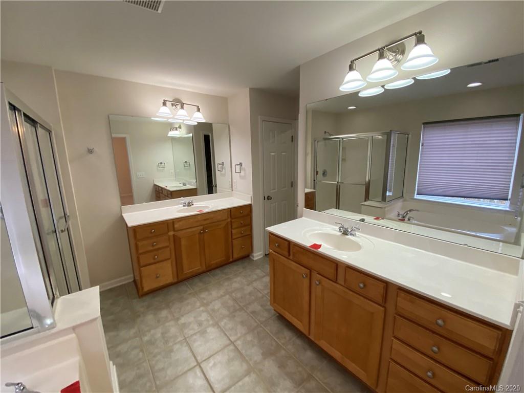 2736 Laurel Cherry Street Raleigh, NC 27612 - Photo 6 of 14 a spacious bathroom with a double vanity sink mirror and double