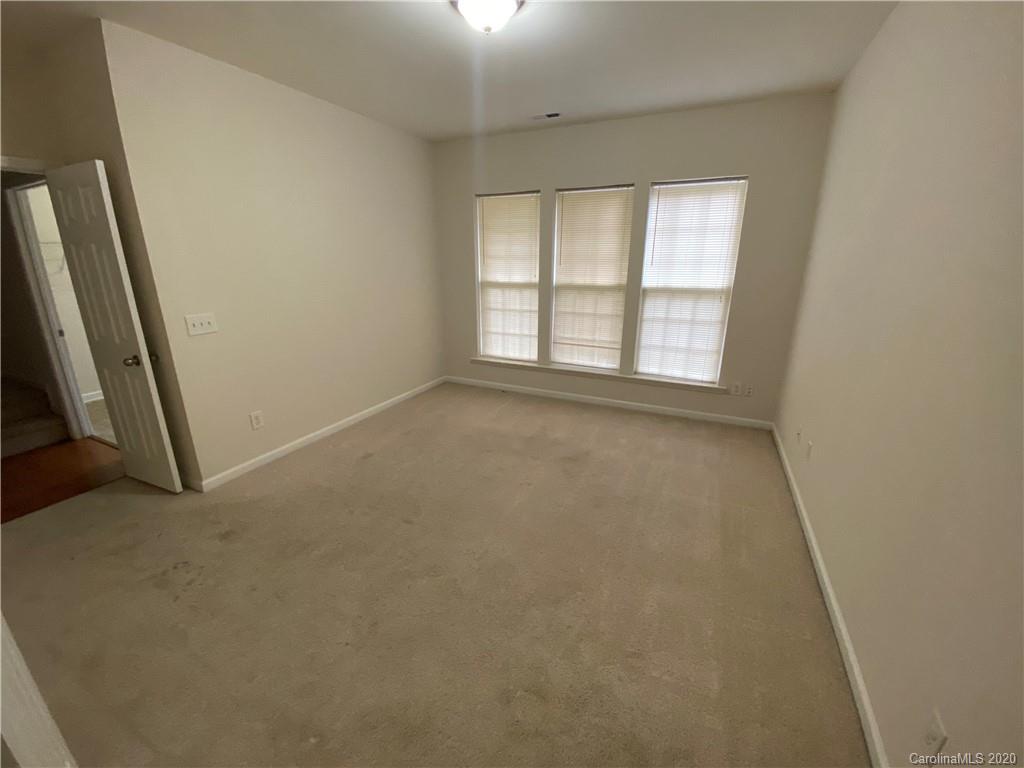 2736 Laurel Cherry Street Raleigh, NC 27612 - Photo 10 of 14 an empty room with a empty space and a window