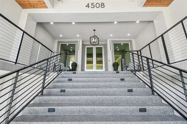 a view of a hallway with a kitchen