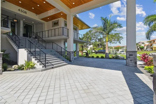 a kitchen with stainless steel appliances a sink stove and refrigerator