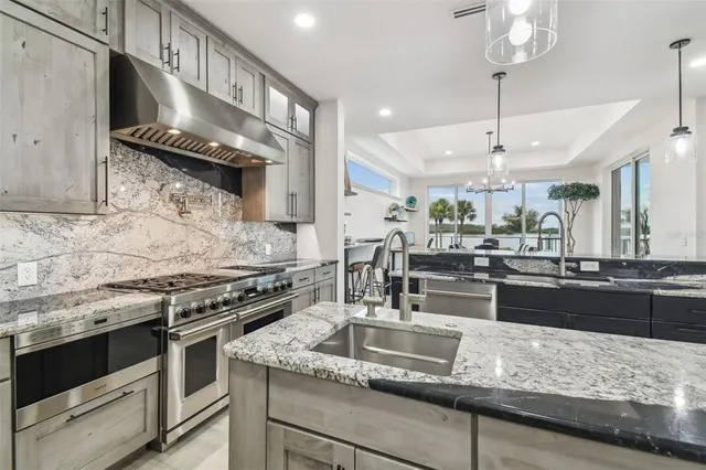 a view of a work space with furniture and windows
