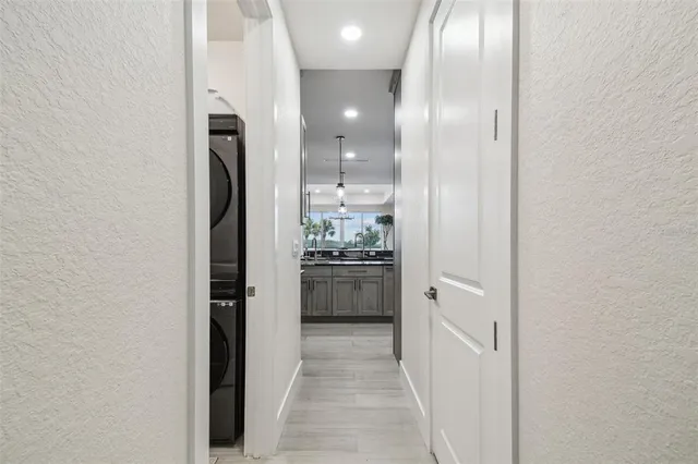a kitchen with stainless steel appliances granite countertop a sink and a stove