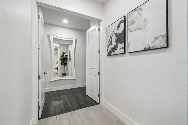 a view of a house with swimming pool and sitting area