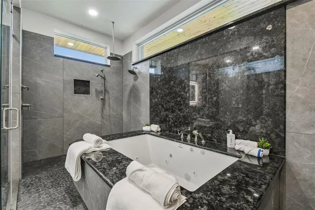 a terrace with outdoor seating and water view