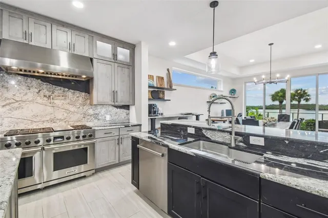 a view of a backyard with potted plants