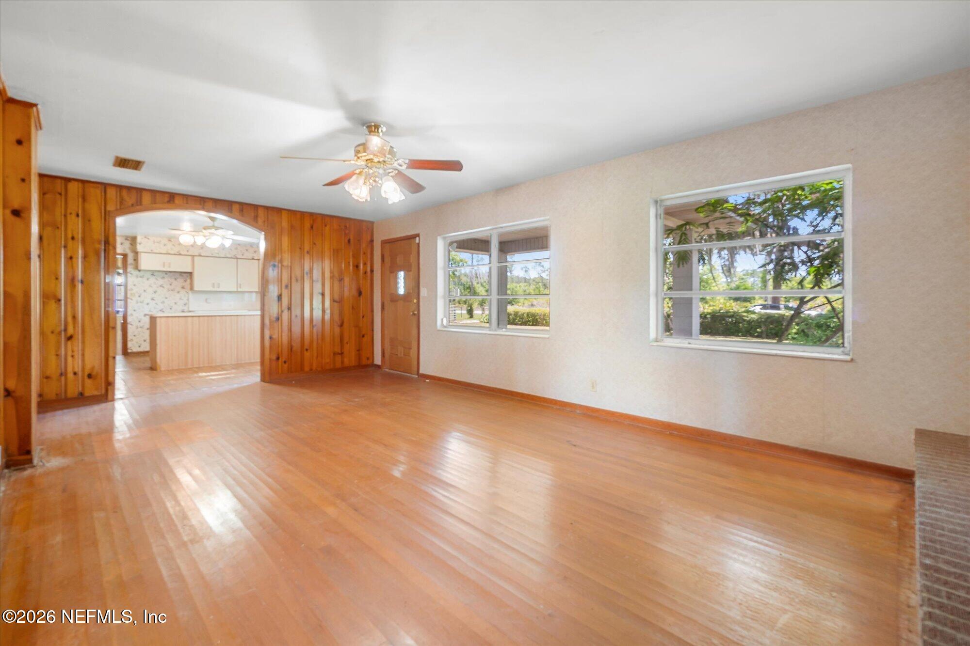 786 West River Road Palatka, FL 32177 - Photo 12 of 53 a view of an empty room with a window and wooden floor