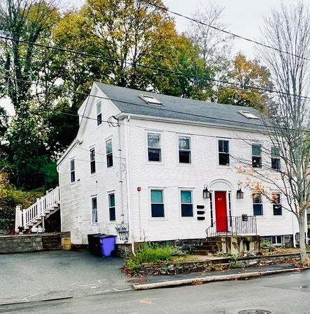 a view of white house with a street